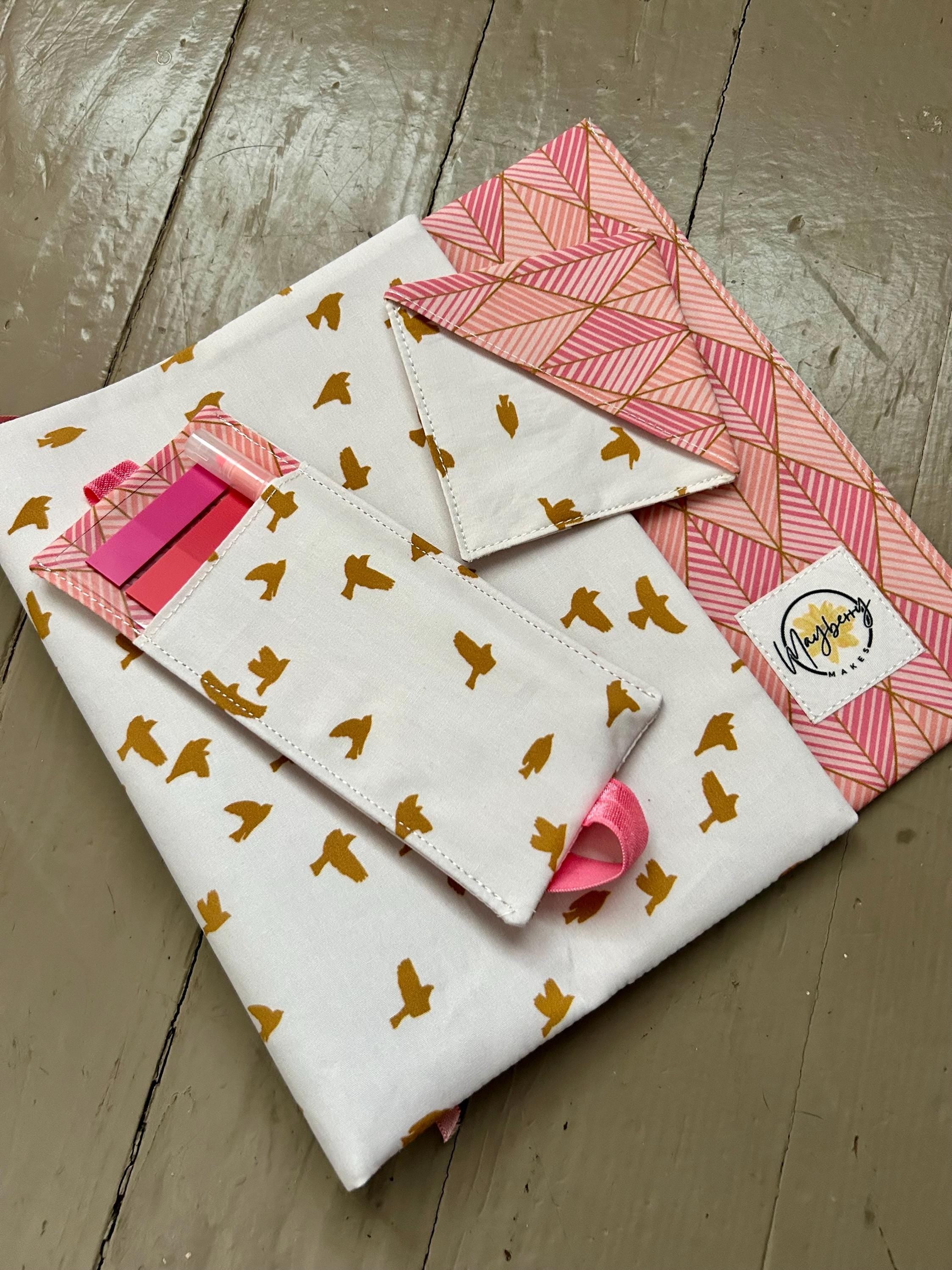 Fabric with gold bird pattern on a white background